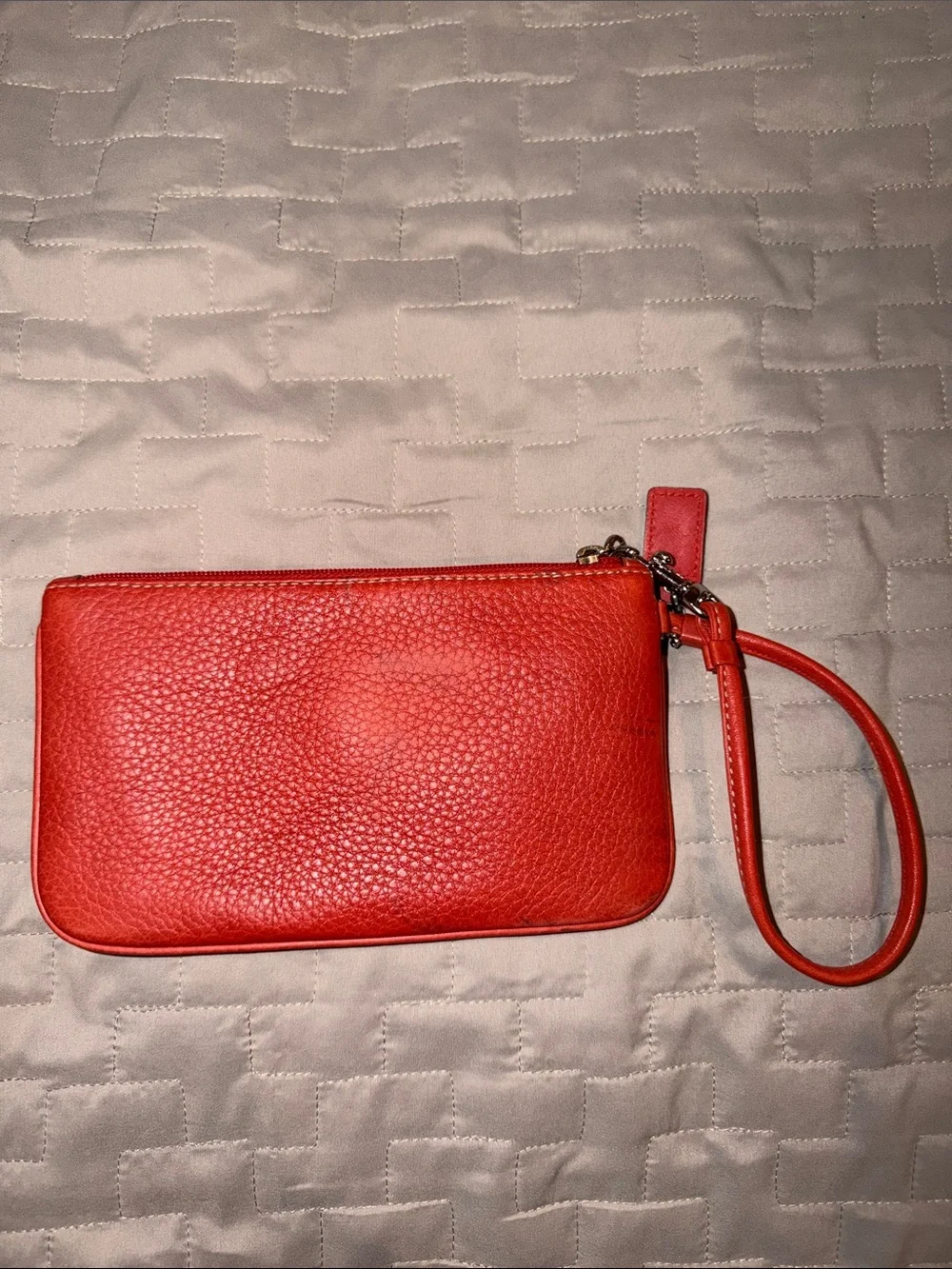 Coach Hamilton Pebbled Leather Flap Wristlet in Geranium Coral